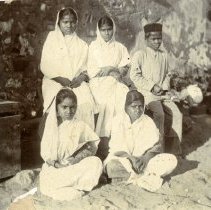 Seated boy and girls